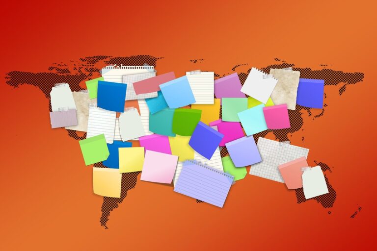 An orange map of the world is obscured by piles on post-it notes in a rainbow of colors.