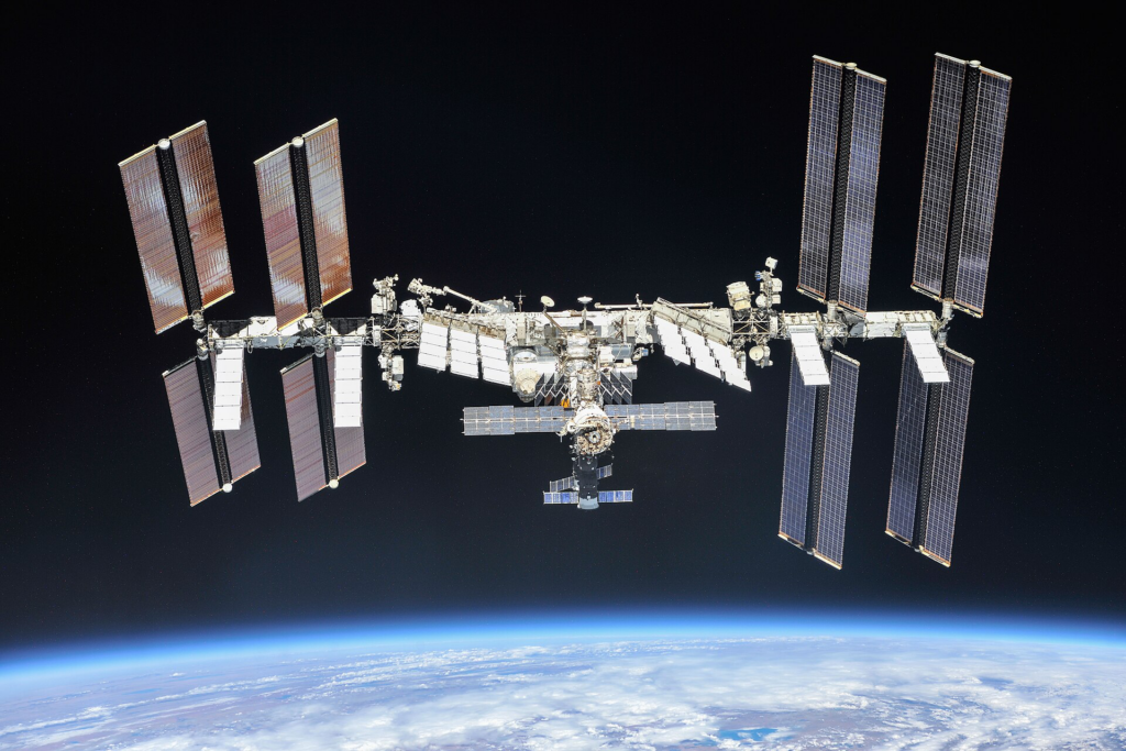 Photo of the International Space Station with Earth in the background taken from space.